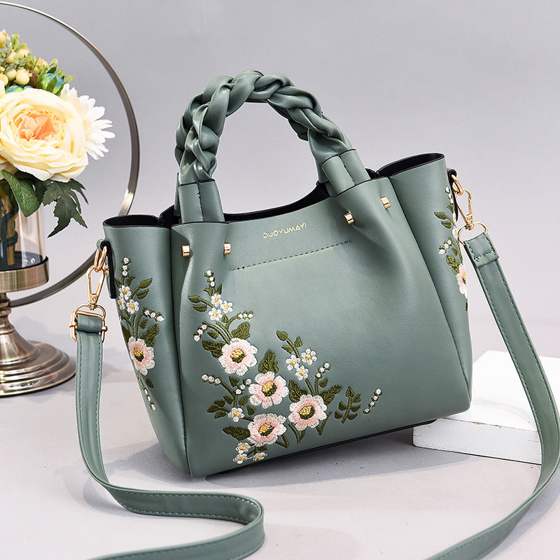 Black PU leather handbag with a simple plain design
