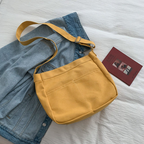 Canvas crossbody tote bag for students with a casual streetwear style