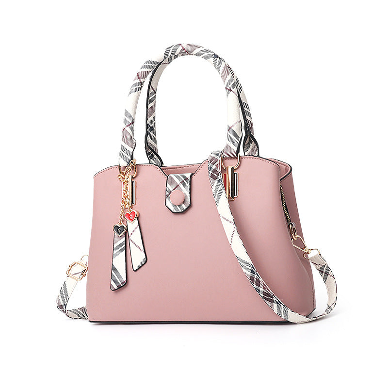 Fashionable women's Boston bag with a leather shoulder strap