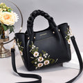 Medium women's PU leather tote bag with a drawstring closure