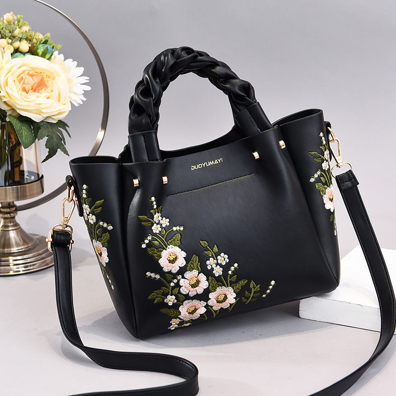 Medium women's PU leather tote bag with a drawstring closure