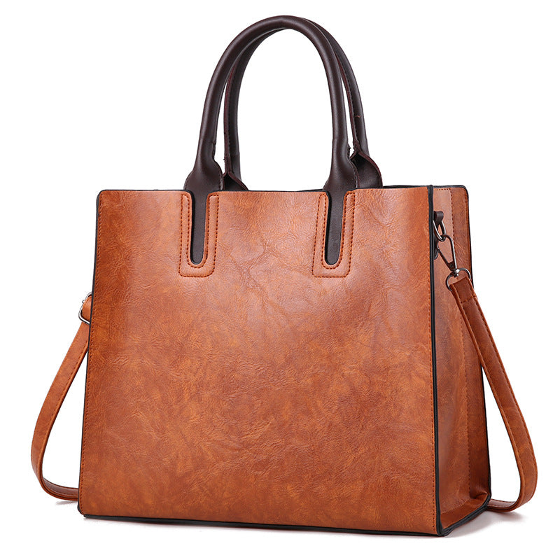 Women's large PU leather handbag with a plain casual design
