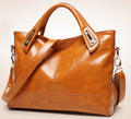 Women's medium square PU leather handbag with a plain design