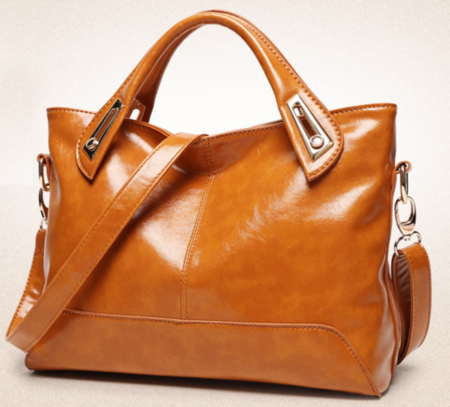 Women's medium square PU leather handbag with a plain design
